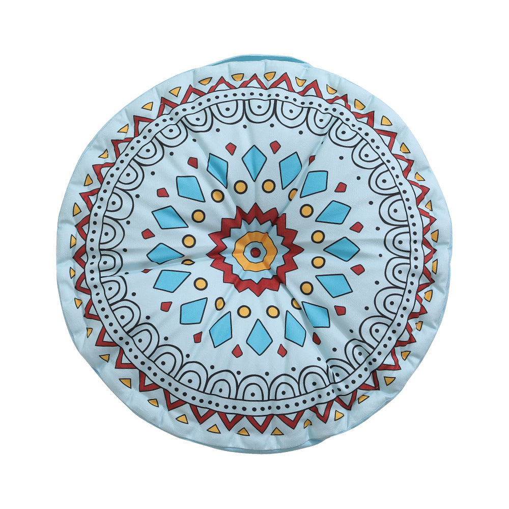 Round floor cushion with medal print, carrying handle and quilted padding