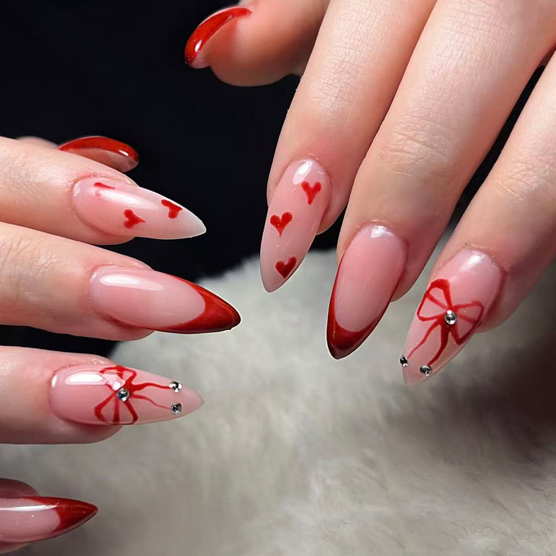 Artificial nails with elegant heart designs and glamorous accents Stornfield
