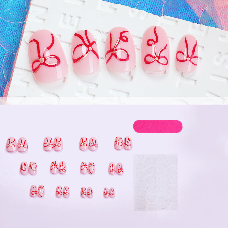 Artificial nail design with bow motifs Stornfield