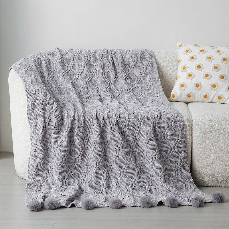 Ladies knit blanket with decorative pom poms Stornfield
