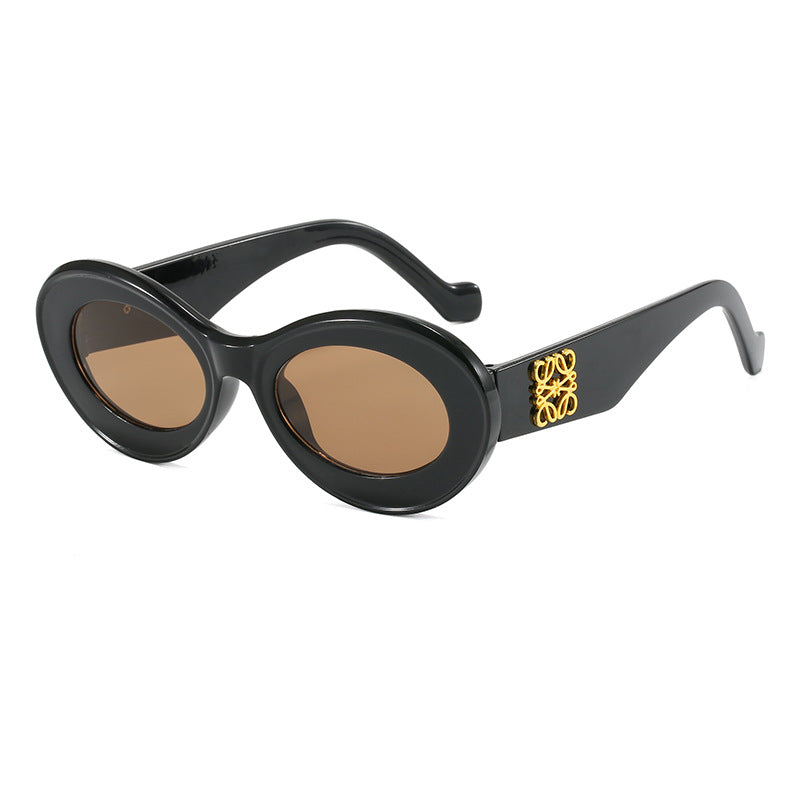Women's fashionable sunglasses with oval frame and golden applications Stornfield