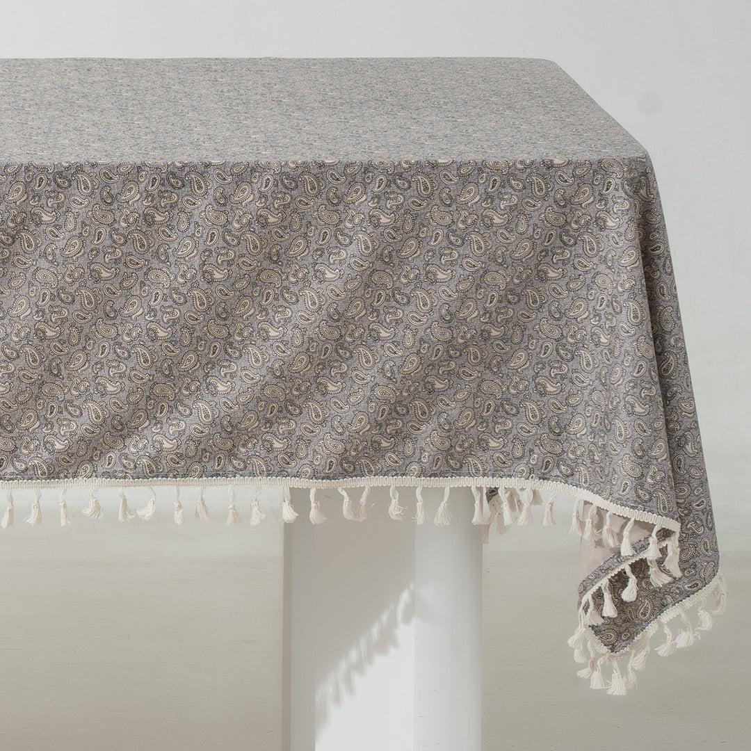 Rectangular tablecloth made of cotton-linen blend with delicate floral print and tassels