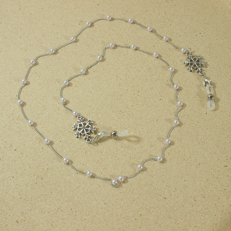 Elegant glasses holder chain with pearls and snowflake pendant Stornfield