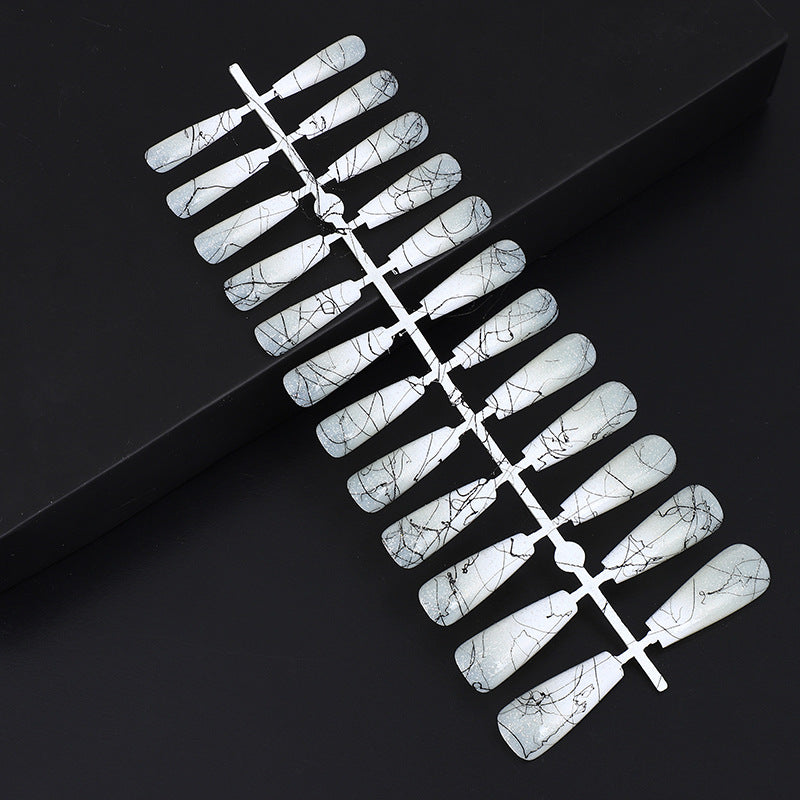 Artificial nails in modern ombre design with marbled accents Stornfield