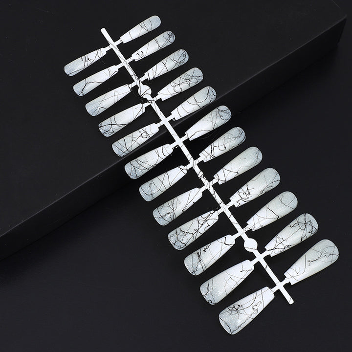 Artificial nails in modern ombre design with marbled accents Stornfield