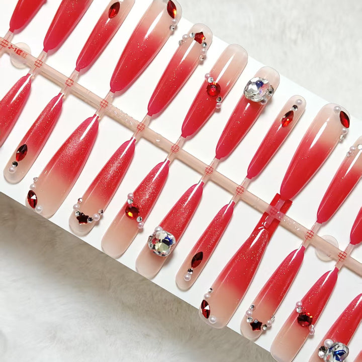 Glamorous artificial nails with sparkling ombre effect and elegant embellishments Stornfield