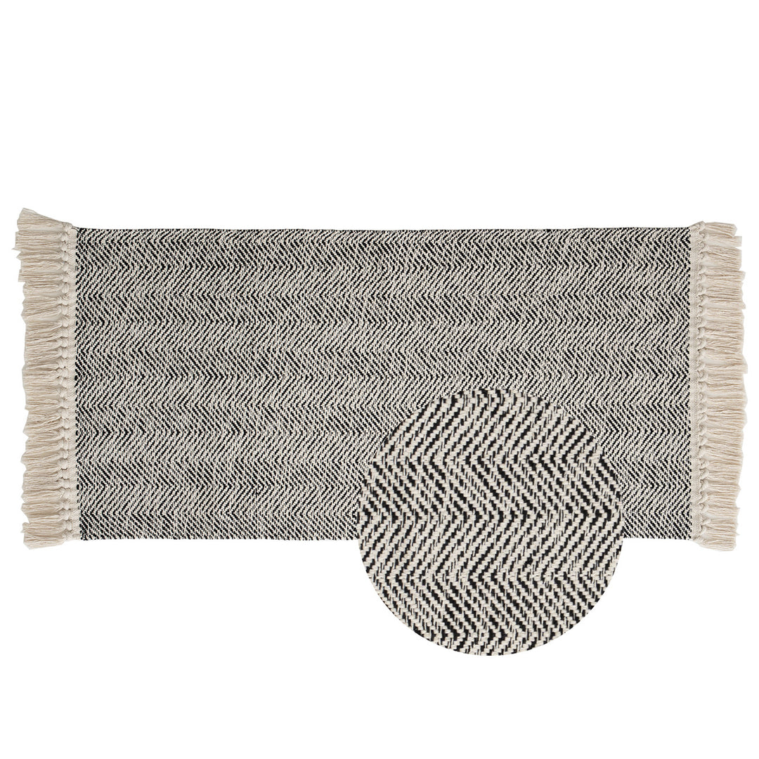 Braided runner rug with herringbone pattern and fringe edge Stornfield