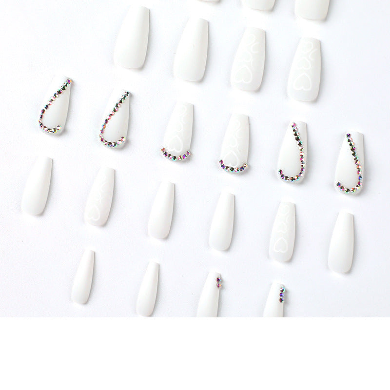 Artful Nail Extensions with Heart Design and Glitter Accents Stornfield