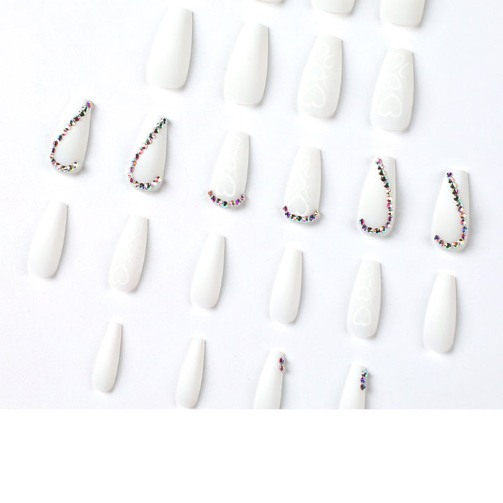 Artful Nail Extensions with Heart Design and Glitter Accents Stornfield