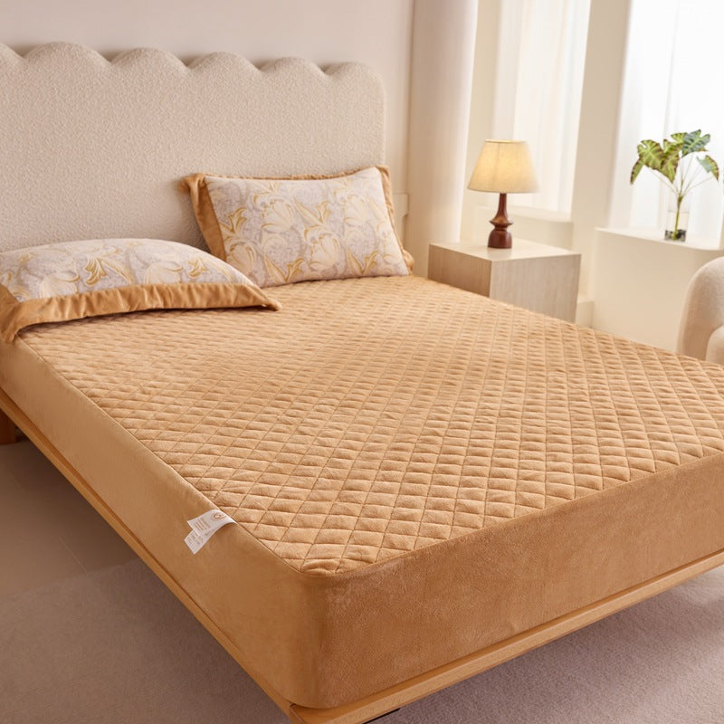 Quilted mattress protector with non-slip bottom and soft microfiber cover