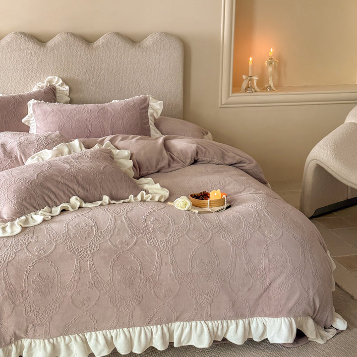 Quilted bedding set with ruffle and medallion relief