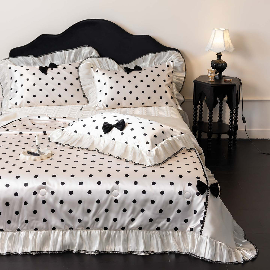 Romantic polka dot satin bedding set with ruffles and decorative ribbons