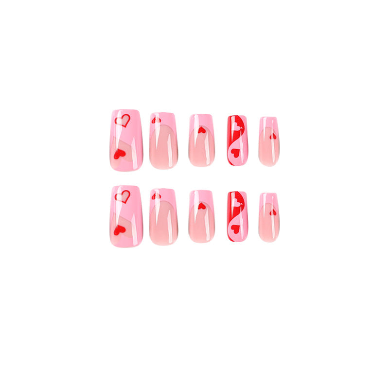 Artificial nail art with heart design and glitter accents Stornfield