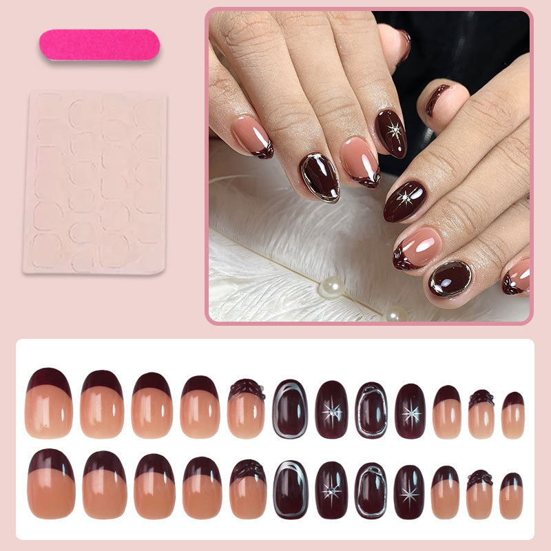 Acrylic nail set with elegant gradient and delicate embellishments Stornfield