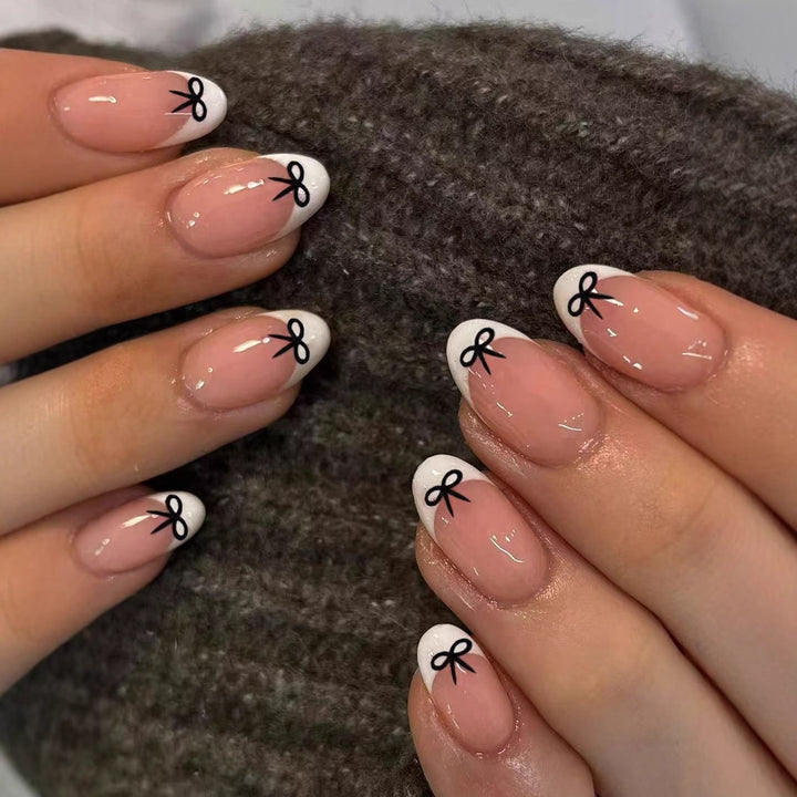 Artificial nails with elegant bows and high-gloss surface Stornfield
