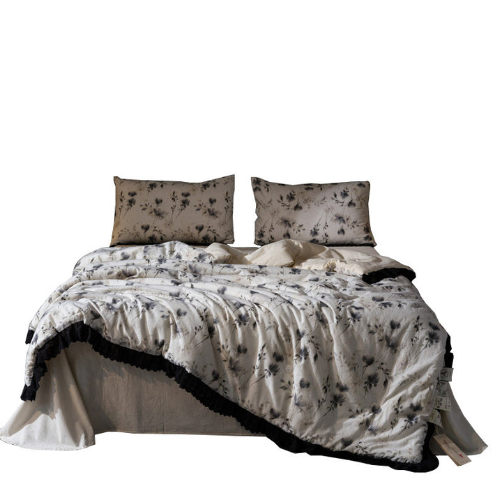 Bedding set made of cotton blend with subtle floral stitching pattern and lace border