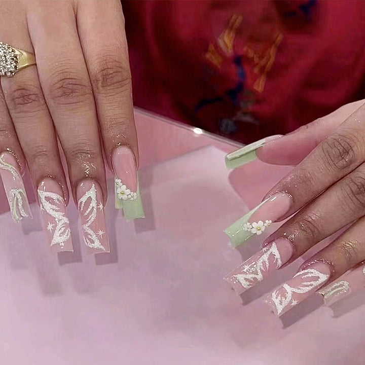 Elegant artificial nails with floral designs Stornfield