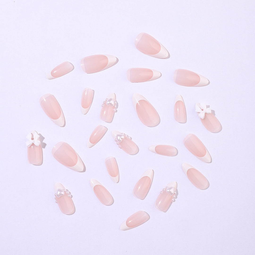 Artificial nail set with elegant pearl and bow decorations Stornfield