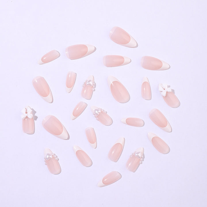Artificial nail set with elegant pearl and bow decorations Stornfield