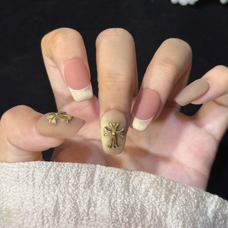 Artificial nail set with festive gift design and elegant glitter accents Stornfield