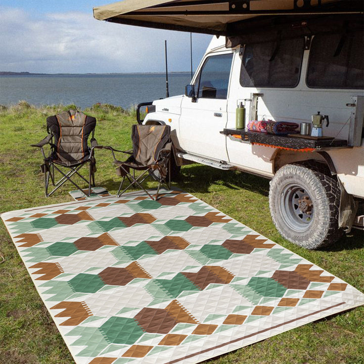 Quilted picnic and beach blanket set with carrying strap and water-repellent back