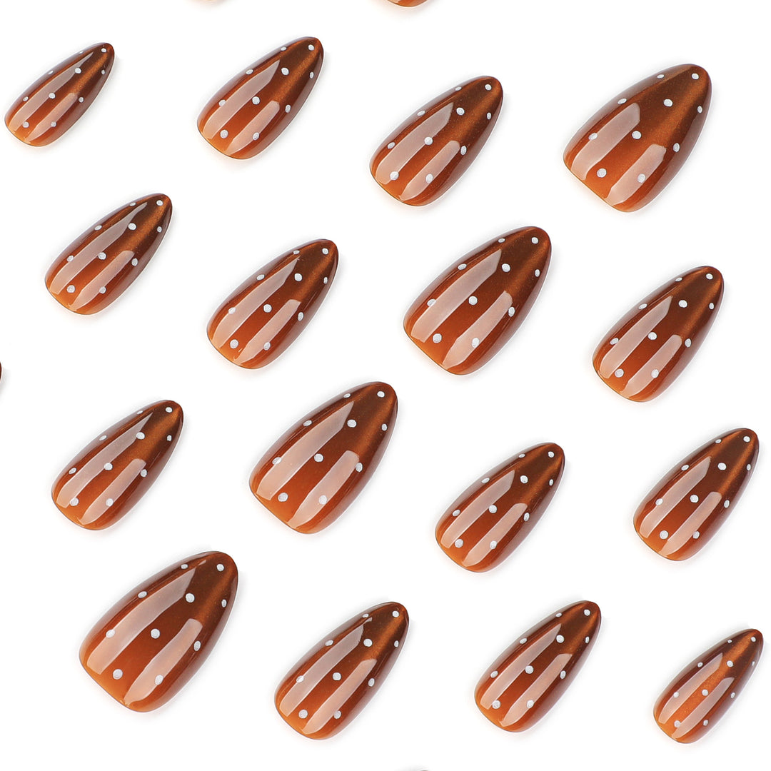 Artful nail extensions with glossy ombre effect and elegant dots Stornfield