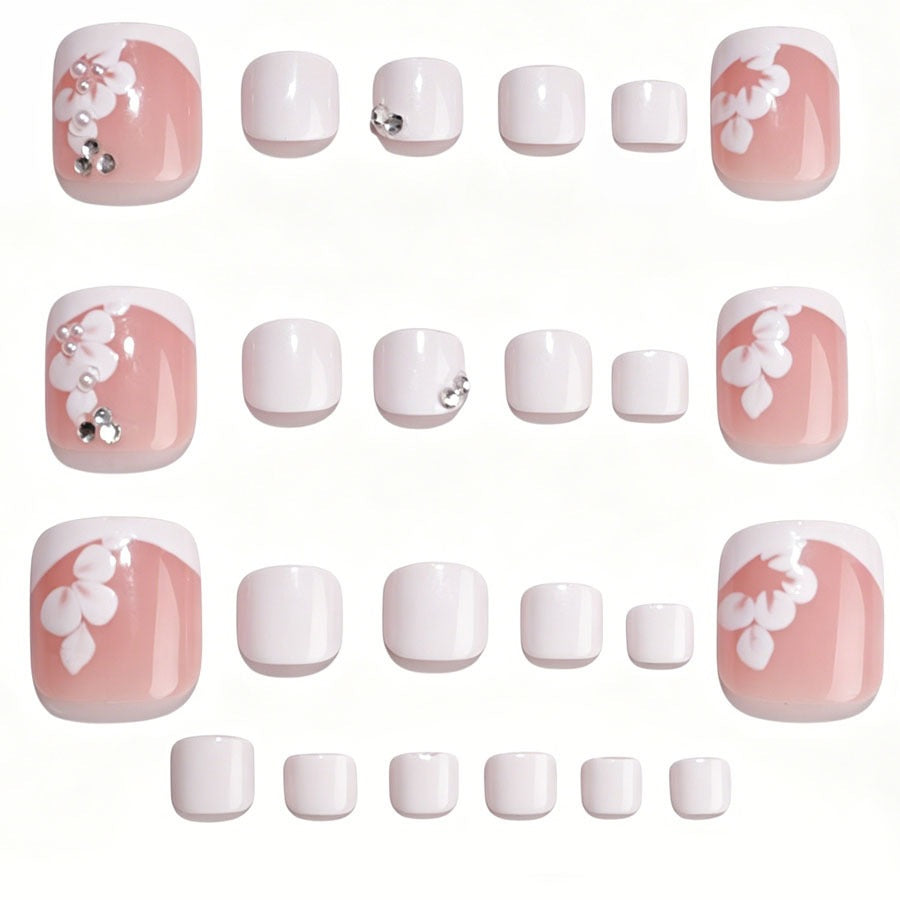 Nail art set with elegant flower design and glitter accents Stornfield