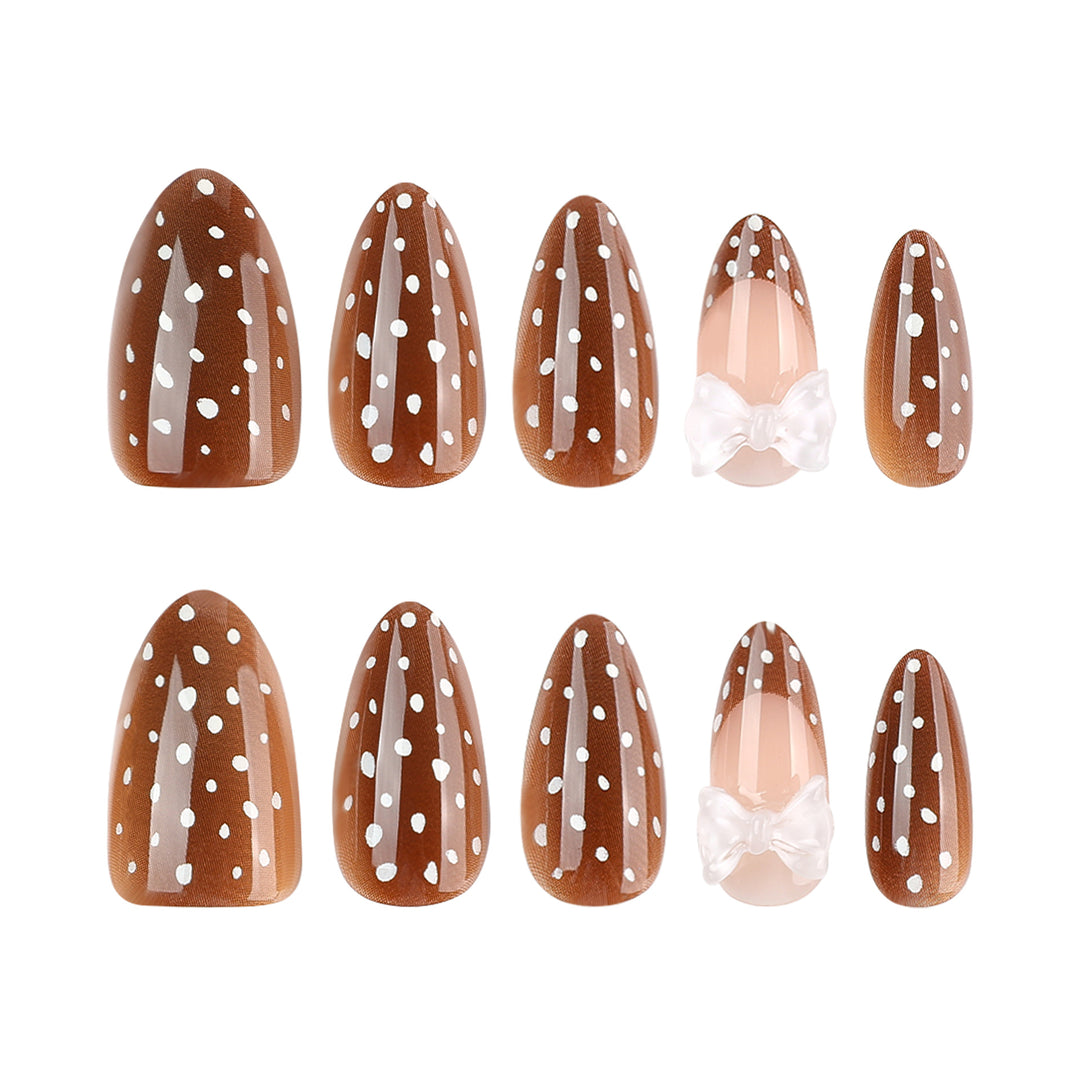 Artistic stiletto nails with delicate bow motif Stornfield