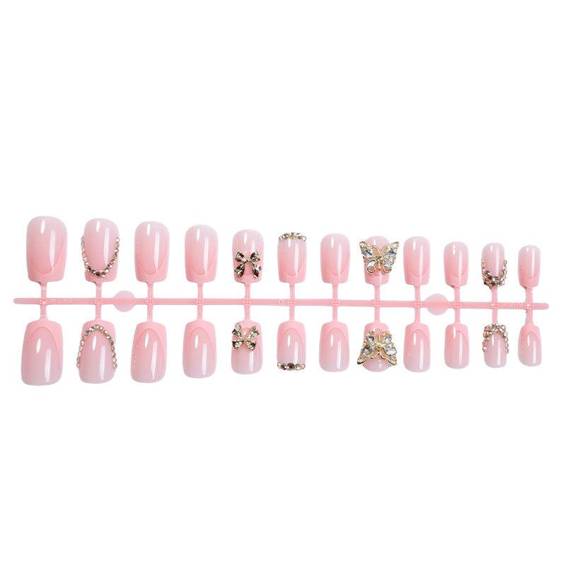 Glamorous artificial nail set with floral accents and glitter decorations Stornfield