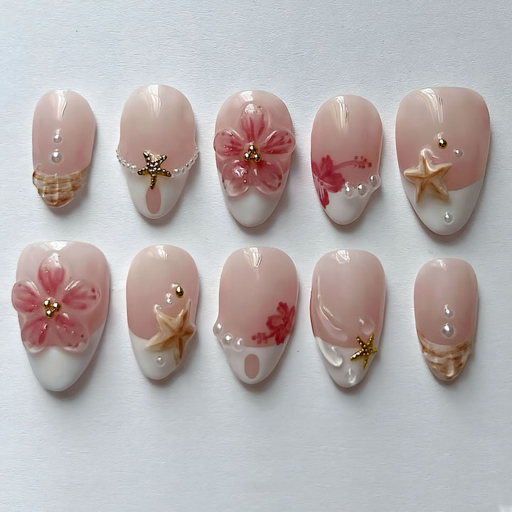 Elegant artificial nails with floral designs and glitter accents Stornfield