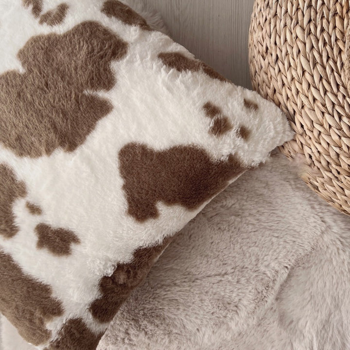 Decorative pillow with cow pattern