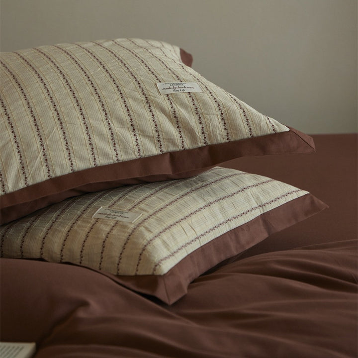 Luxurious cotton bedding set with ruffled trim and pillowcases
