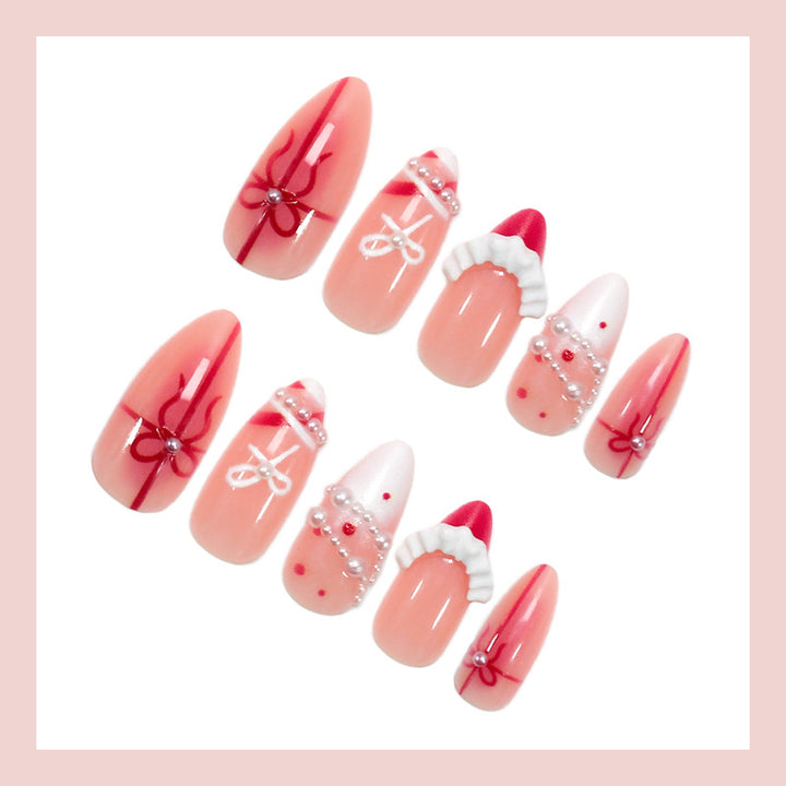 Nail set with glamorous bows and elegant pearl embellishments Stornfield