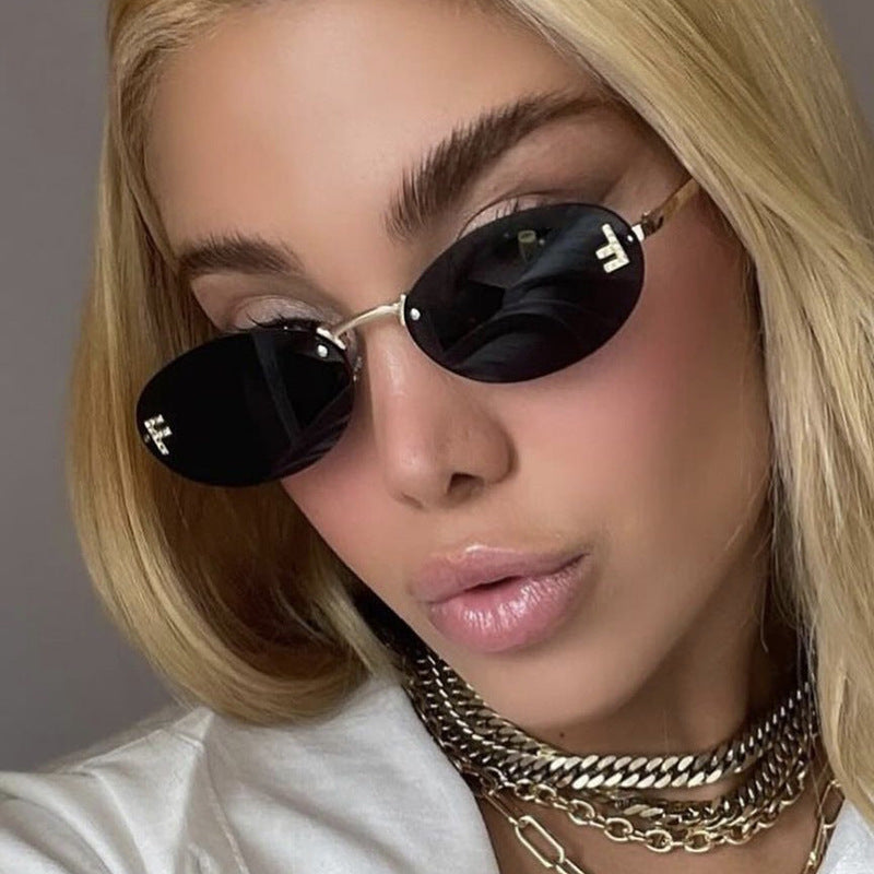 Women's fashionable sunglasses with elegant, round lenses and delicate metal frame Stornfield