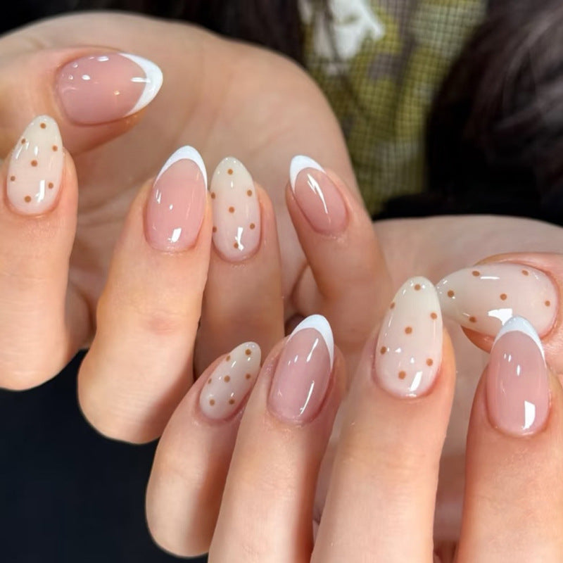 Elegant nail art with modern dots and French tips Stornfield