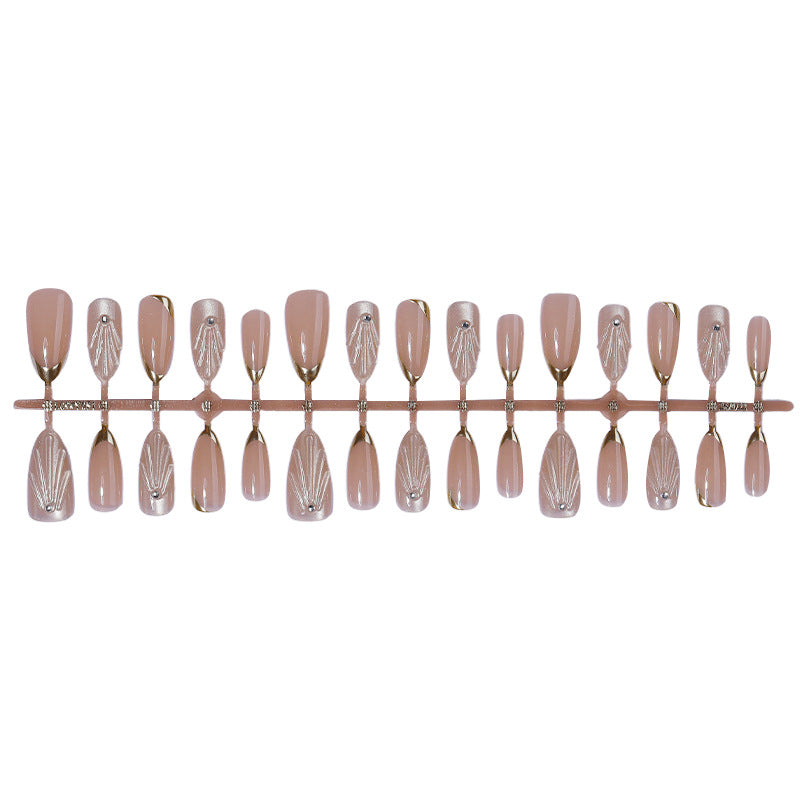 Artificial nail set with elegant gold tips and artistic decorations Stornfield