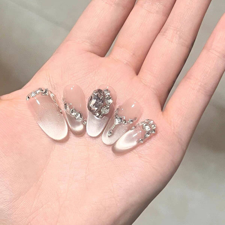 Artistic Stiletto Press-On Nail Art with Glimmering Accents Stornfield