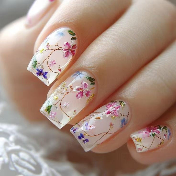 Nail set with floral accents and transparent shine Stornfield