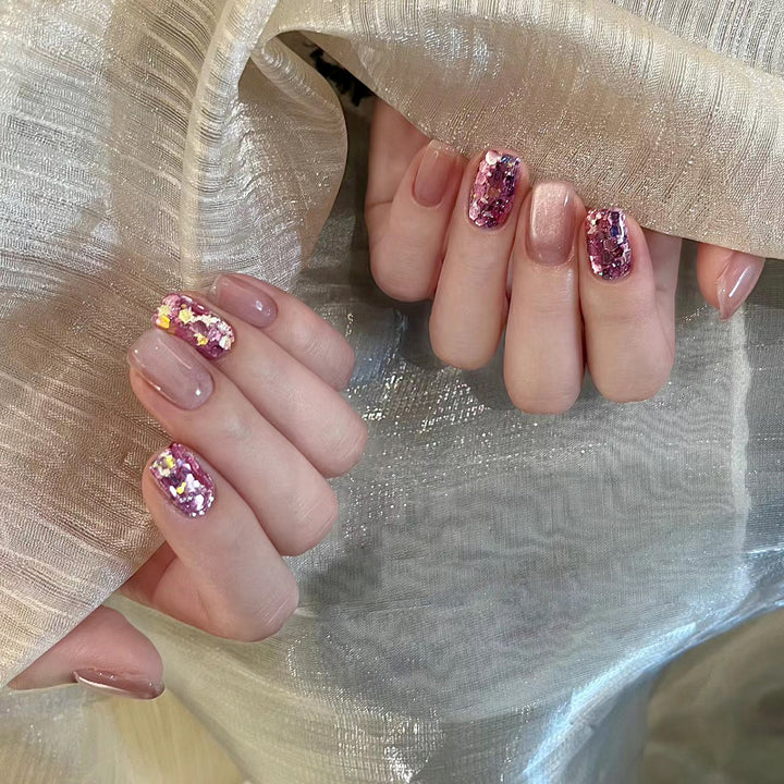 Artificial nail art with glitter and glamour effects Stornfield