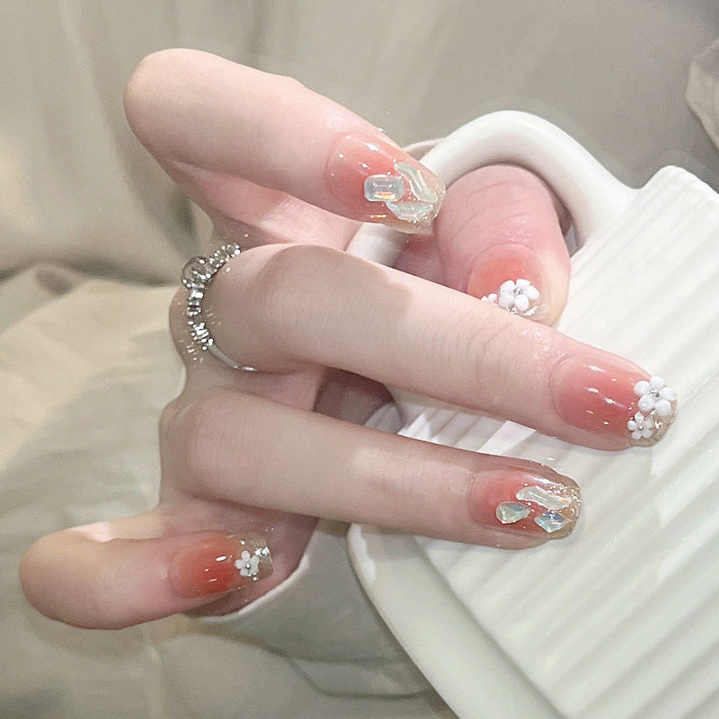 Artificial nail set with floral 3D decorations and elegant glitter Stornfield
