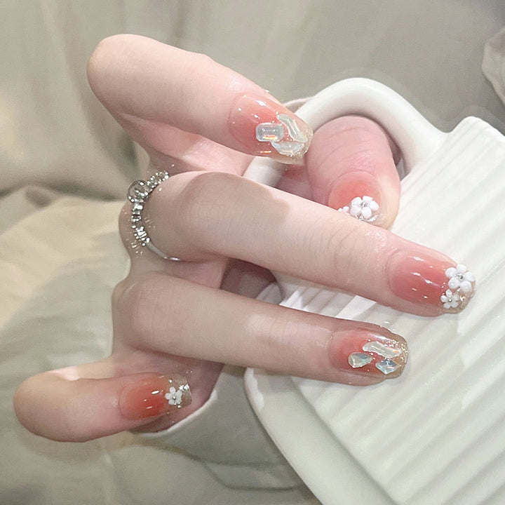 Artificial nail set with floral 3D decorations and elegant glitter Stornfield