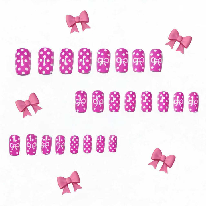 Artificial nails with romantic polka dot pattern and bow Stornfield