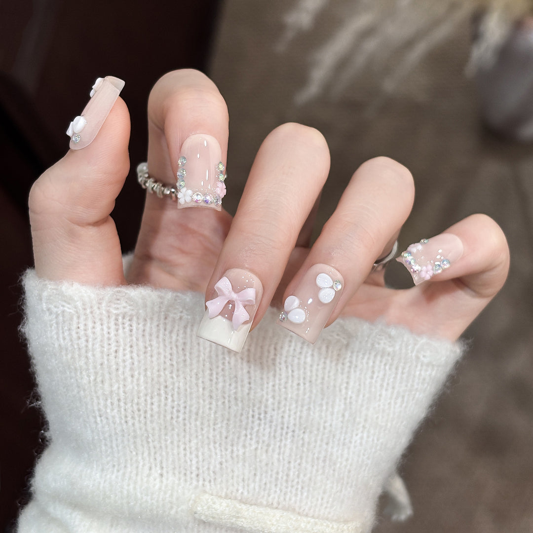 Decorative Nail Art Set with Floral Details and Bow Accents