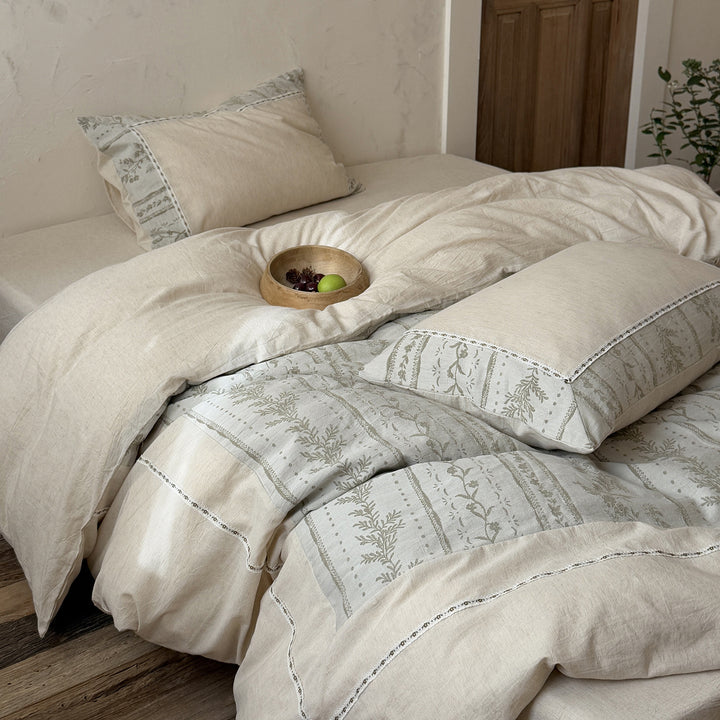 Natural linen-cotton bedding set with embroidered border and vintage pattern