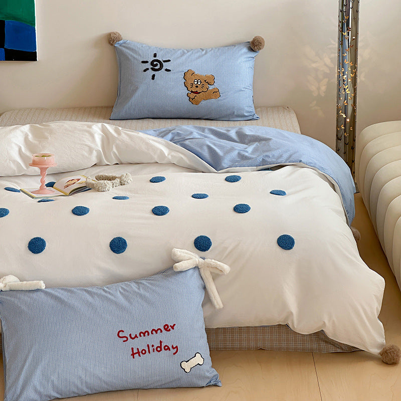 Children's bedding set with striped duvet cover, checkered decorative pillow, and plush application