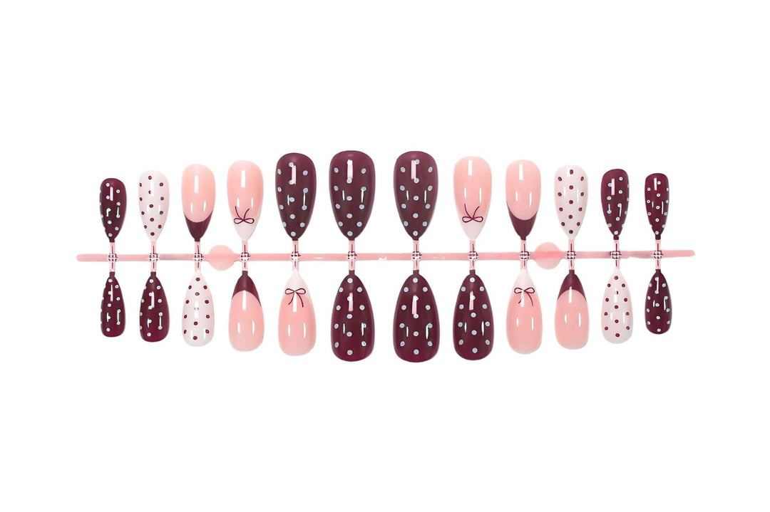Artificial nail set with elegant bow and dot motifs Stornfield