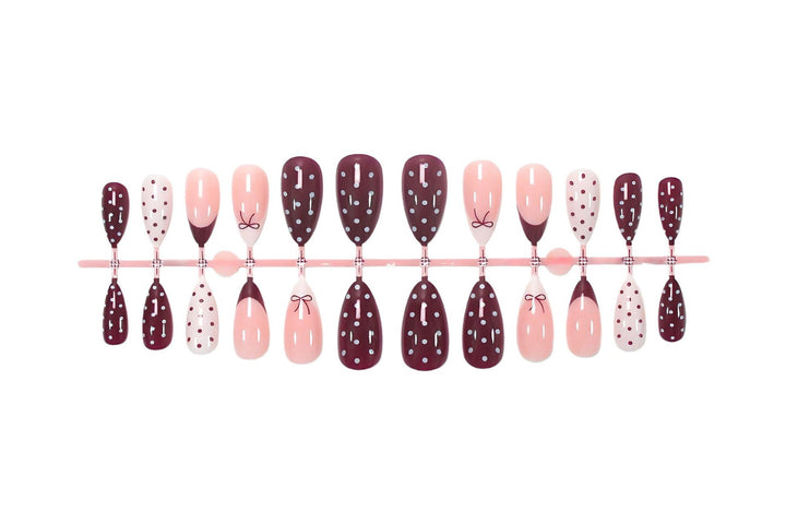 Artificial nail set with elegant bow and dot motifs Stornfield