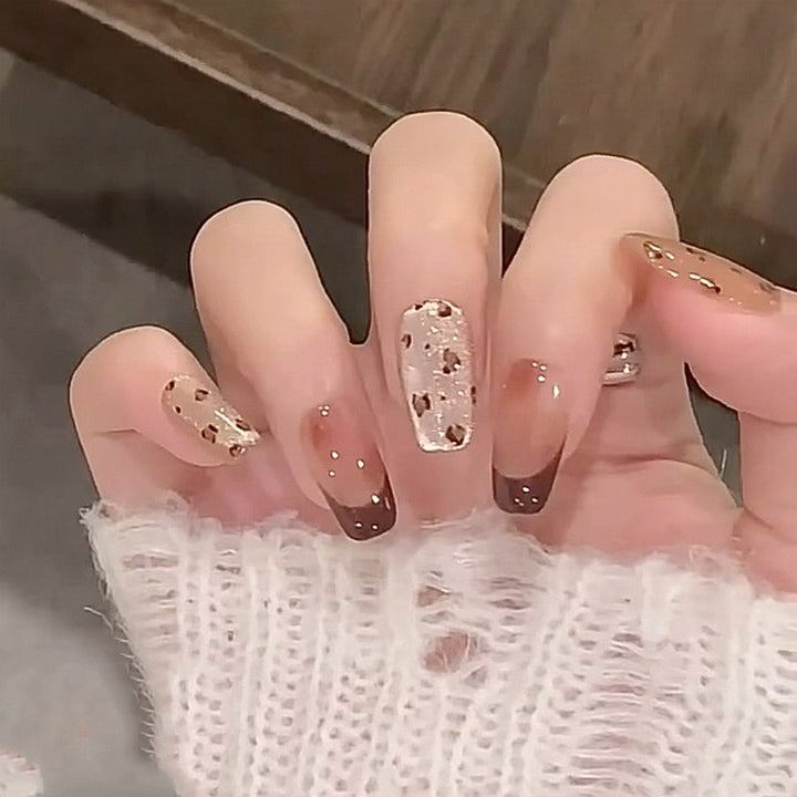 Artistic nail extensions with elegant glitter design Stornfield