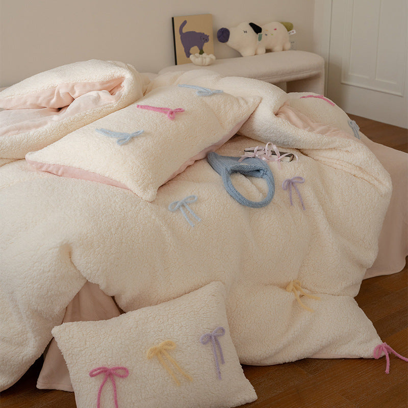 Reversible teddy fleece bedding set with 3D bow appliqués and heart decorative pillow
