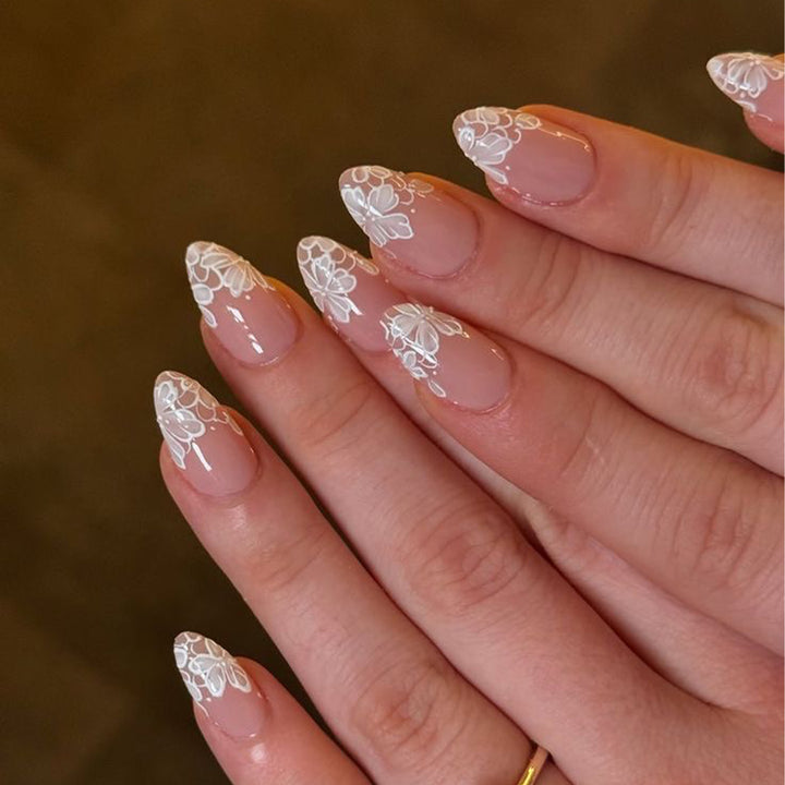 Artistic stiletto nails with floral embellishments Stornfield